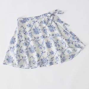 UO Wendy Satin Floral Mini Skater Wrap Skirt